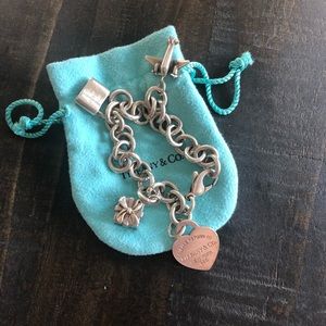 Authentic Tiffany bracelet with 4 charms.